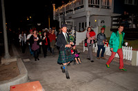 Only in So Cal - a piper leading a HuGe group of people, and a rare glimpse of the Joker next to him...