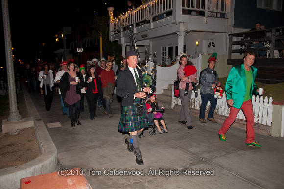 Only in So Cal - a piper leading a HuGe group of people, and a rare glimpse of the Joker next to him...
